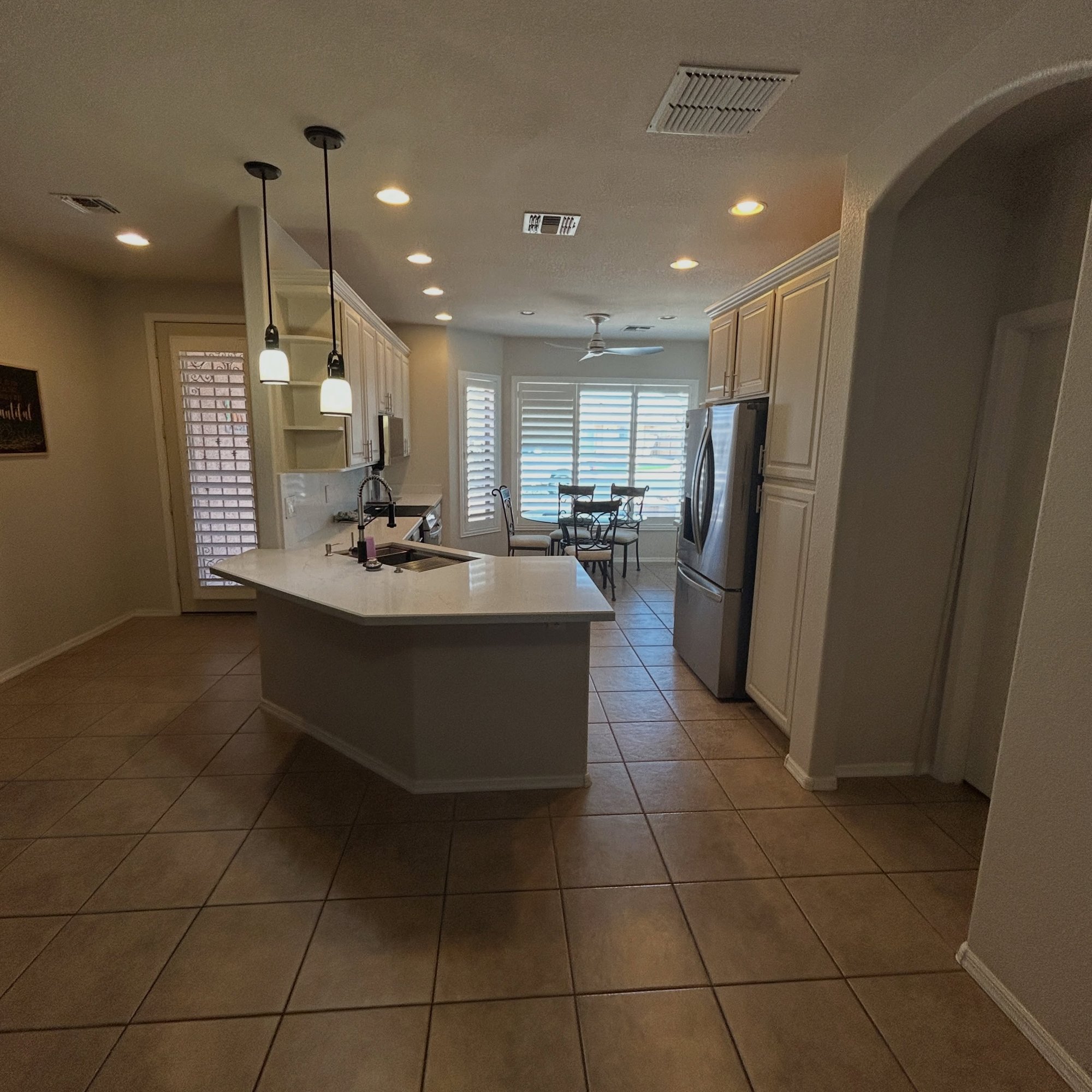 After: the island and dining side of the kitchen.