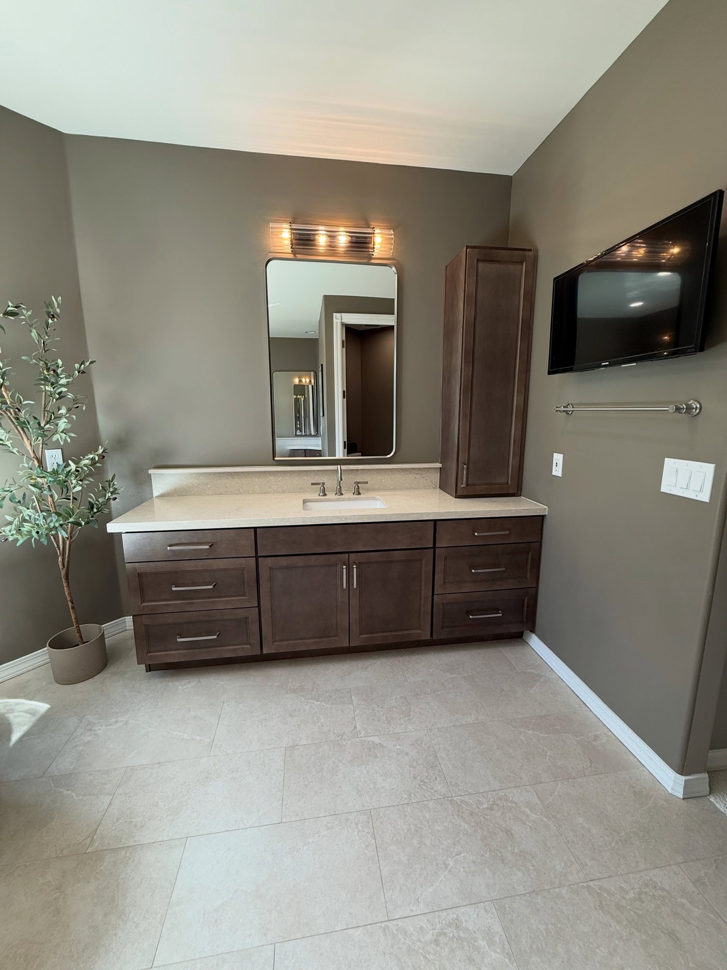 Master vanity with rich wood cabinetry